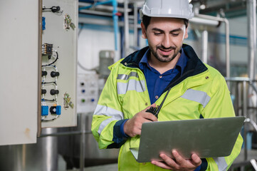 professional technician engineer working to control electrical power and safety service system, electrician working to maintenance and checking industrial equipment in term of factory technology