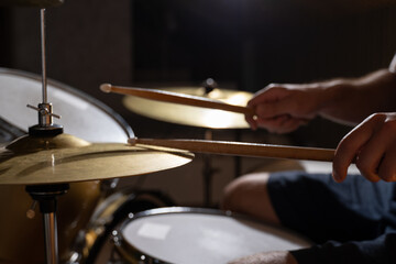 Fototapeta na wymiar Professional drummer playing on drum set 