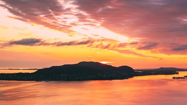 Alesund, Norway. Amazing Natural Bright Dramatic Sky In Warm Colours Above Alesund Valderoya And Islands In Sunset Time. Colorful Sky Background. Beauty In Norwegian Nature.