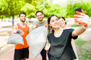 Beautiful woman taking a picture with her friends