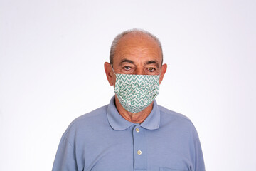 elderly man wearing covid protective fabric mask, on white background