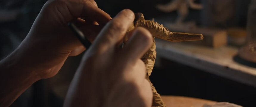 Sculptor artist hand shape sculpture art use clay model tool close up