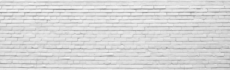 Brick wall painted with white paint.