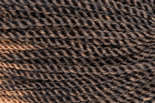 Texture of brown hair extension braids 
