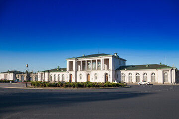 Fototapeta na wymiar Building of railway station in the city of Pushkin, Tsarskoe Selo. Blue sky, empty street, summertime