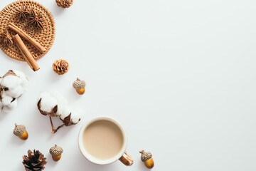 Autumn composition. Cotton, cup of coffee, pine cones, acorns, cotton on white background. Autumn,...