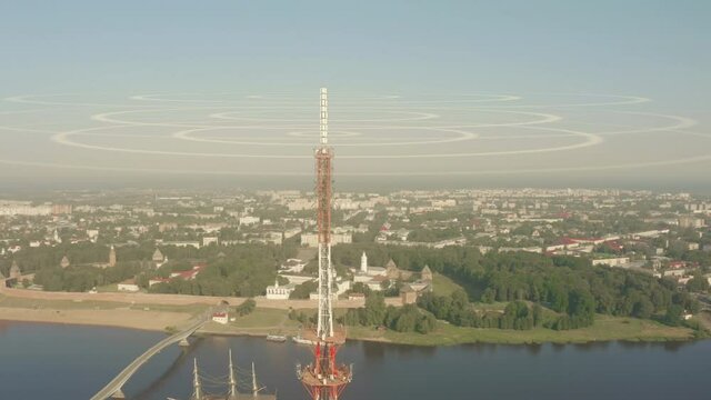 Aerial view of a telecom tower emitting visualized radio waves, conceptual animation