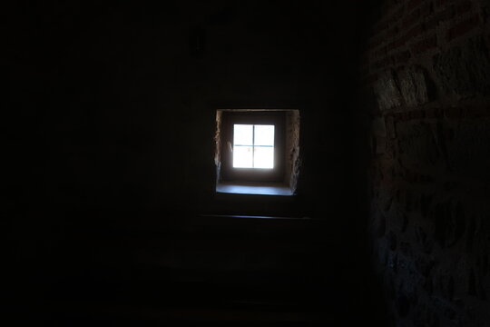 Small window in dark room