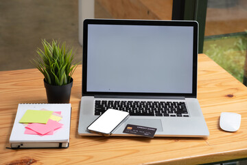 Top view of workspace with Online payments concept, Smartphone blank screen for advertisement with...