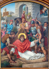 VIENNA, AUSTIRA - JUNI 17, 2021: The painting of Fall of Jesus under the cross as part of Cross way stations in church Marienkirche by redemptorist Maximilian Schmalzl from end of 19. cent.