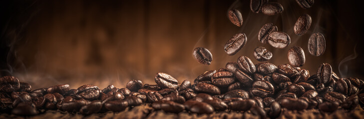 
Close-up Of Fresh Roasted Coffee Beans With Smoke Falling Onto Table 