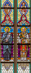 VIENNA, AUSTIRA - JUNI 24, 2021: The St. Vincent de Paul and Clement Maria Hofbauer and St. Agnes on the stained glass of church St. Severin.