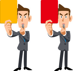 イエローカードとレッドカードを見せるスーツ姿の男性
