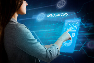 Business, Technology, Internet and network concept. Young businessman working on a virtual screen of the future and sees the inscription: Remarketing