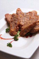 deep fried wu xiang pork meat roll with sauces in white background fusion asian halal menu