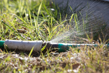 Hose pipe burst with water spraying and flooding