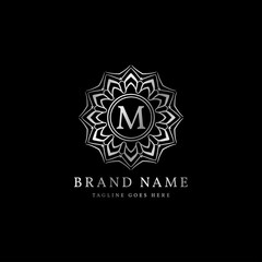 abstract round luxury letter M logo design for elegant fashion brand, beauty care, yoga class, hotel, resort, jewelry
