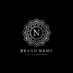 abstract round luxury letter N logo design for elegant fashion brand, beauty care, yoga class, hotel, resort, jewelry