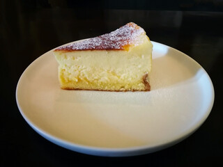 Slice of plain Marble Cheesecake on white plate
