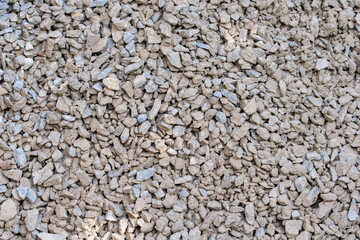 The texture of dirty rubble. Background of small stone covered with mud