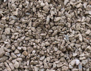 The texture of dirty rubble. Background of small stone covered with mud