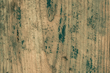 The texture of an old wooden board with paint residue