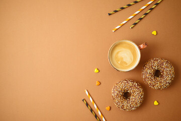 Coffee cup and donuts. Autumn party concept background.