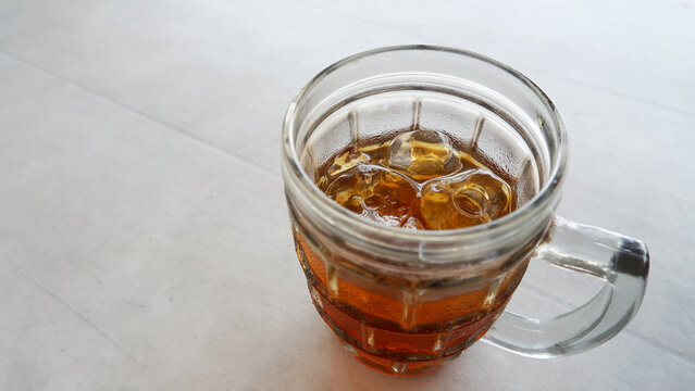 Yogyakarta-27 Juli 2021 Very fresh iced tea drink with lots of ice cubes on a white background