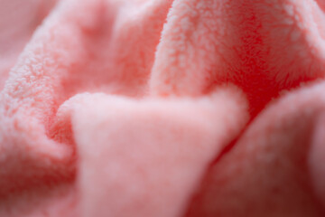 Pink towel background. wave soft fabric. new modern design luxurious light and soft wave smooth shape silk wallpaper. free space. for card poster or presentation products concept.