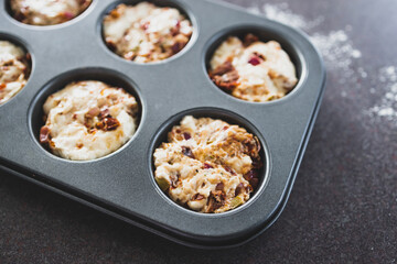 vegan focaccia savory muffins with sundried tomatoes and olives before getting baked in the oven, healthy plant-based food