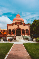  Kali temple in the famous Bengali community of Chittaranjan Park. Indian Kaali goddess temple with beautiful blue sky in background.