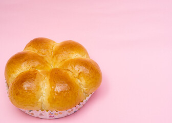 Bread on light pink background.