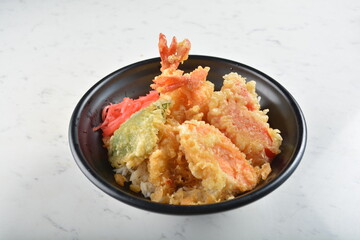 japanese deep fried tempura prawn and vegetables rice bowl in black bowl in white marble healthy poke bowl menu
