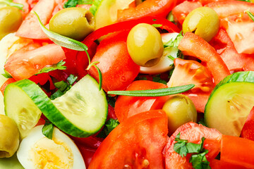 Salad with vegetables, olives, eggs and rosemary