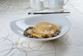 braised luxury fish maw with millet in white background asian halal seafood menu