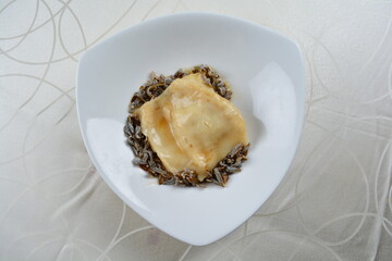 braised luxury fish maw with millet in white background asian halal seafood menu