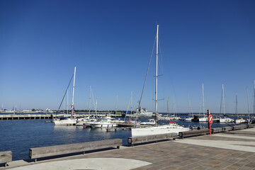 Seaview in Noblessner district. Yachts and sailing boats on the dock. A sunny summer day with a clear blue sky. Tallinn, Estonia, Europe