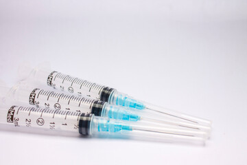 syringe with a needle isolated on white background