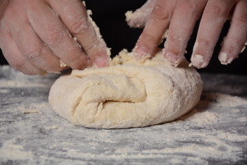 Process of making home-made dough for dumplings, ravioli or pelmeni with minced meat.