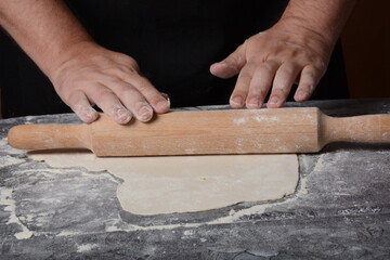 Process of making home-made dough for dumplings, ravioli or pelmeni with minced meat.