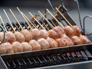 Sai krok Isan on grill of charcoal stove for street food - obrazy, fototapety, plakaty