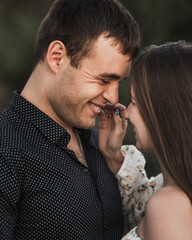 Close up sensual portrait of young couple in love, together, happy, looking at each other