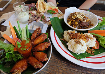 Fried sticky rice served with northern thai curry, chicken wings and Battered deep fried calamari