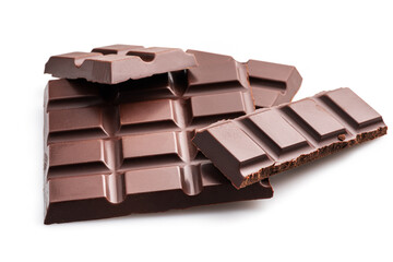 Pieces of dark chocolate bar isolated on white background. Sweet food is made of cocoa and sugar.
