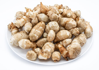 Jerusalem artichoke roots isolated on white background.