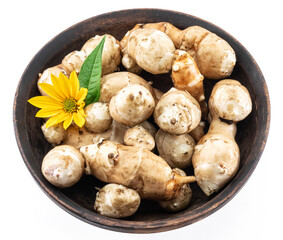 Jerusalem artichoke roots with leaves and flower of Jerusalem artichoke isolated on white background.