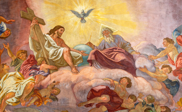VIENNA, AUSTIRA - JULI 5, 2021: The fresco of Holy Trinity in Jesuitenkirche - Jesuits church by jesuit Andrea Pozzo from begin of 18. cent.