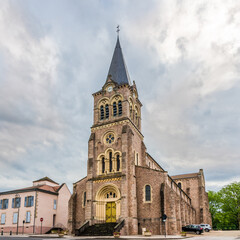 Fototapeta na wymiar Church of saint Jean Baptiste in the streets of Lapalisse town - France.
