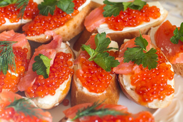 sandwiches with butter, red fish and red caviar