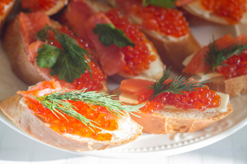 sandwiches with butter, red fish and red caviar